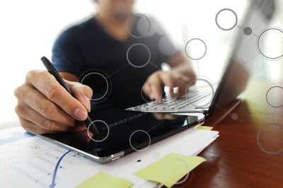 Young creative designer man working at office and social network media diagram as concept